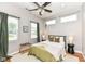 Cozy bedroom with natural light, ceiling fan and modern décor at 1221 Cottage Ave, Indianapolis, IN 46203