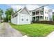 Landscaped yard with a well-maintained lawn and a charming home in the background at 1221 Cottage Ave, Indianapolis, IN 46203