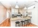Modern kitchen with granite countertops, stainless steel appliances, and stylish bar stools at 1221 Cottage Ave, Indianapolis, IN 46203