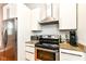 This kitchen has granite countertops, stainless steel appliances, and white cabinets at 1221 Cottage Ave, Indianapolis, IN 46203