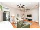 A cozy living room with hardwood floors, comfortable seating, and lots of natural light at 1221 Cottage Ave, Indianapolis, IN 46203