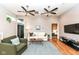 Comfortable living room with stylish furniture, hardwood floors, and open doorway at 1221 Cottage Ave, Indianapolis, IN 46203