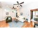 Cozy living room with hardwood floors, seating, and a glimpse into the bedroom at 1221 Cottage Ave, Indianapolis, IN 46203