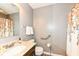 Cozy bathroom with a granite countertop, floral shower curtain, and accessibility features at 1314 Old Heritage Pl, Greenwood, IN 46143