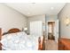 Comfortable bedroom featuring a patterned bedspread, neutral walls, and closet for optimal organization at 1314 Old Heritage Pl, Greenwood, IN 46143