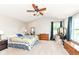Bright bedroom with a ceiling fan, carpet floors, and lots of natural light at 1314 Old Heritage Pl, Greenwood, IN 46143