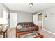 Cozy living room features a leather futon, neutral walls, and carpeted floors for a welcoming space at 1314 Old Heritage Pl, Greenwood, IN 46143