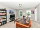 Relaxing living room with a comfortable futon, carpet flooring, and an entertainment center at 1314 Old Heritage Pl, Greenwood, IN 46143