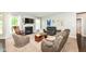 Comfortable living room with a fireplace, large windows and neutral color palette at 1314 Old Heritage Pl, Greenwood, IN 46143