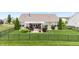 Aerial view of a well-maintained backyard with patio, pergola, and manicured landscaping at 13327 Hockley Dr, Fishers, IN 46037