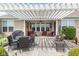 Spacious backyard patio featuring comfortable seating, dining area, and a charming pergola at 13327 Hockley Dr, Fishers, IN 46037