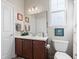 Bathroom features a vanity with cherry cabinets, white countertops, and a toilet at 13327 Hockley Dr, Fishers, IN 46037