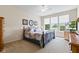 Bedroom with carpet flooring, ceiling fan, and large windows at 13327 Hockley Dr, Fishers, IN 46037