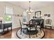 Inviting dining room features hardwood floors, bright windows, and a decorative rug at 13327 Hockley Dr, Fishers, IN 46037