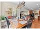 Bright dining room featuring modern light fixture and sliding glass door to backyard patio at 13327 Hockley Dr, Fishers, IN 46037