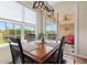 Dining room features a sliding glass door with a backyard view and modern light fixture at 13327 Hockley Dr, Fishers, IN 46037