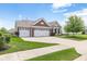 Charming brick home with a well-manicured lawn, attached two-car garage, and inviting curb appeal at 13327 Hockley Dr, Fishers, IN 46037