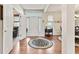 Bright foyer with hardwood floors, high ceilings, and a decorative rug, creating an inviting entrance at 13327 Hockley Dr, Fishers, IN 46037