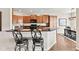 Stylish kitchen featuring granite countertops, dark cabinets, and modern appliances at 13327 Hockley Dr, Fishers, IN 46037