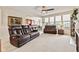 Spacious living room with comfortable seating and open access to the dining area at 13327 Hockley Dr, Fishers, IN 46037