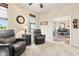 Cozy living room features a plush recliner, a window with blinds, and a neutral color scheme at 13327 Hockley Dr, Fishers, IN 46037