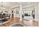 Open-concept space with hardwood floors and multiple sitting areas for seamless living and entertaining at 13327 Hockley Dr, Fishers, IN 46037
