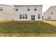 Spacious backyard with ample grass space and a well-maintained exterior of the home at 1381 Delacorte Cir, Shelbyville, IN 46176