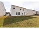 Spacious backyard with ample grass space and a well-maintained exterior of the home at 1381 Delacorte Cir, Shelbyville, IN 46176