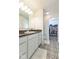Modern bathroom with stylish tile floor, white vanity, and walk-in closet at 1381 Delacorte Cir, Shelbyville, IN 46176