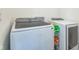 Modern laundry room featuring a newer Samsung washer and dryer set and convenient storage at 1381 Delacorte Cir, Shelbyville, IN 46176