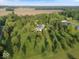 Breathtaking aerial shot of a sprawling estate, surrounded by lush landscapes and mature trees at 14301 W County Road 300 S, Daleville, IN 47334
