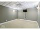 Simple basement space with a mounted TV and neutral decor at 14301 W County Road 300 S, Daleville, IN 47334