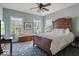 Comfortable bedroom featuring a ceiling fan and bright windows, perfect for relaxation at 14301 W County Road 300 S, Daleville, IN 47334