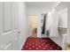 Walk-in closet with a red patterned carpet and white doors at 14301 W County Road 300 S, Daleville, IN 47334