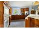 Kitchen featuring custom wood cabinets, stainless steel appliances, and stylish lighting fixtures at 14301 W County Road 300 S, Daleville, IN 47334