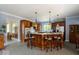 Eat-in kitchen featuring custom wood cabinets, a large center island with seating, and tiled flooring at 14301 W County Road 300 S, Daleville, IN 47334