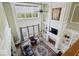 An airy living room featuring soaring ceilings, fireplace, custom built-ins, and plenty of natural light at 14301 W County Road 300 S, Daleville, IN 47334