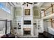 A grand living room boasting high ceilings, custom built-ins, a cozy fireplace, and elegant decor at 14301 W County Road 300 S, Daleville, IN 47334