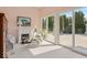 Bright sunroom featuring a fireplace and large sliding glass doors, ideal for relaxation at 14301 W County Road 300 S, Daleville, IN 47334
