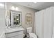 Well-lit bathroom features granite countertops, modern fixtures, and a shower-tub combination at 14442 Treasure Creek Ln, Fishers, IN 46038
