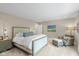 Spacious bedroom with seating area, carpet, natural light, and a beautifully appointed bed at 14442 Treasure Creek Ln, Fishers, IN 46038