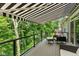 Spacious deck features an awning, a glass railing, and comfortable outdoor seating at 14442 Treasure Creek Ln, Fishers, IN 46038