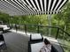Enjoy outdoor living on this spacious deck with awnings and scenic views of the surrounding landscape at 14442 Treasure Creek Ln, Fishers, IN 46038