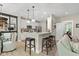 Modern kitchen with stainless steel appliances, granite countertops, and stylish breakfast bar seating at 14442 Treasure Creek Ln, Fishers, IN 46038
