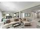Inviting living room features neutral tones, plush seating, and a cozy fireplace at 14442 Treasure Creek Ln, Fishers, IN 46038
