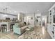 Open-concept living space with a kitchen island, comfortable seating, and a view of the hallway at 14442 Treasure Creek Ln, Fishers, IN 46038