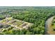 Aerial view of a wooded community next to a river with tree coverage at 14474 Treasure Creek Ln, Fishers, IN 46038