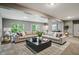 Spacious finished basement with plush seating area, large windows, and neutral decor at 14474 Treasure Creek Ln, Fishers, IN 46038