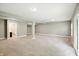 Spacious finished basement featuring neutral carpet and a slider to the outside at 14474 Treasure Creek Ln, Fishers, IN 46038