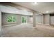 Basement area with natural light, carpeted floors, and a door to outside at 14474 Treasure Creek Ln, Fishers, IN 46038